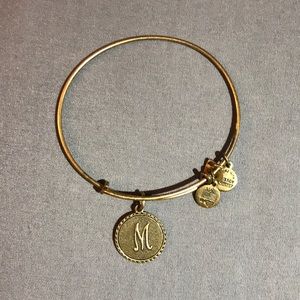 Gold Alex & Ani bracelet w/ “M” monogram pendant
